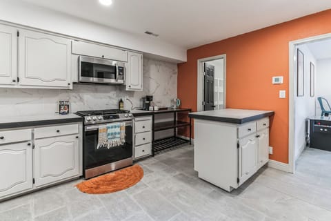 Spacious and fully equipped kitchen with ample cupboards