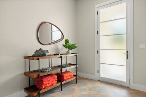 First floor entry way, on the way out to the pool, boat slip, and bbq patio.