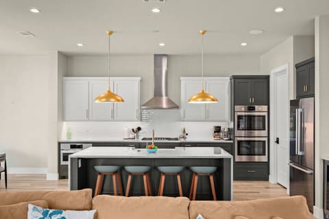 Kitchen and waterfall island from living room.