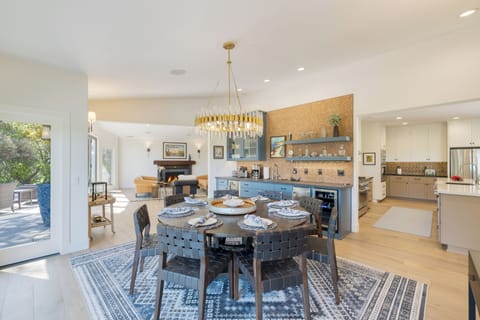 The stunning chandelier centers on a table with seating for 8.