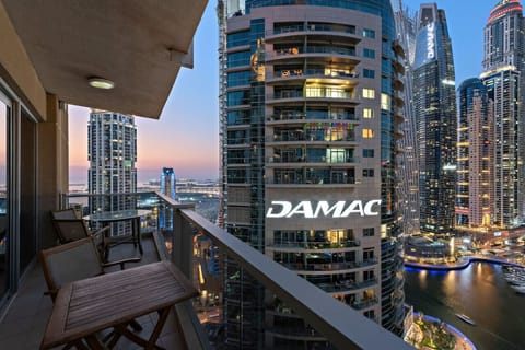 Balcony Retreat: Enjoy stunning skyline views from your private outdoor oasis. Perfect for sunset sips!