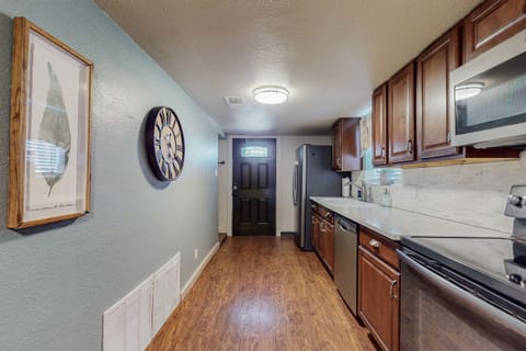 The kitchen is at the entry of the home, and right next to the laundry room where we have a full washer and dryer available.