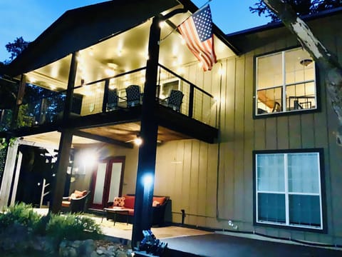The back of the house has inviting outdoor seating on both levels.