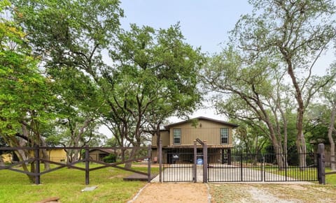 At the front of the house: gated entrance with plenty of parking.