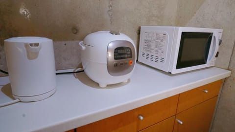 Fridge, microwave, electric kettle, cookware/dishes/utensils