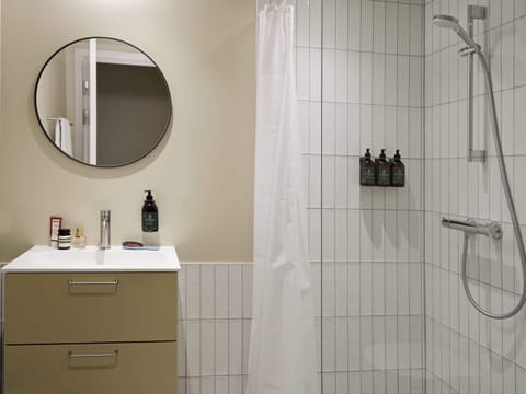 Shower, eco-friendly toiletries, hair dryer, towels