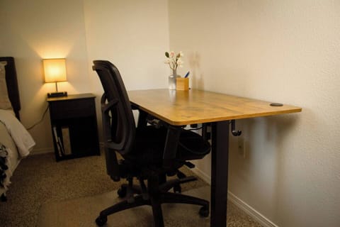Sit stand desk and comfortable, adjustable chair. 