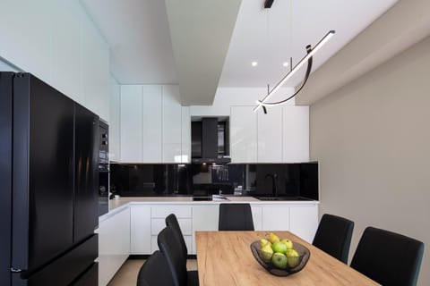 Fully equipped kitchen area with a dining table for 8 guests