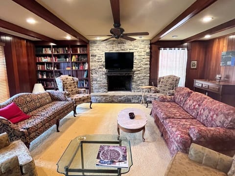 TV, fireplace, books, offices