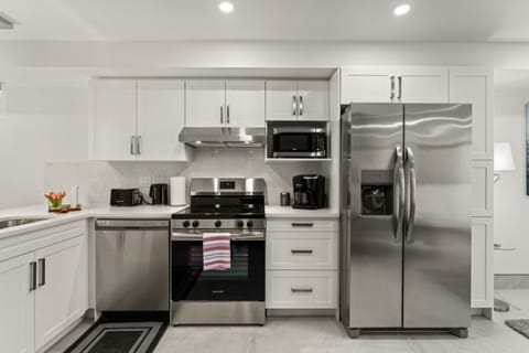 Stainless steel appliances complement contemporary design.