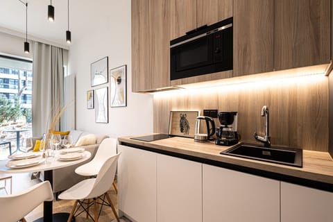 dining table with fully equipped kitchen