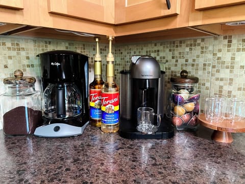 Kitchen - includes cooking utensils, pots, pans, etc. Oh did I mention there is a Nespresso maker with pods provided? And a coffee bar?!
