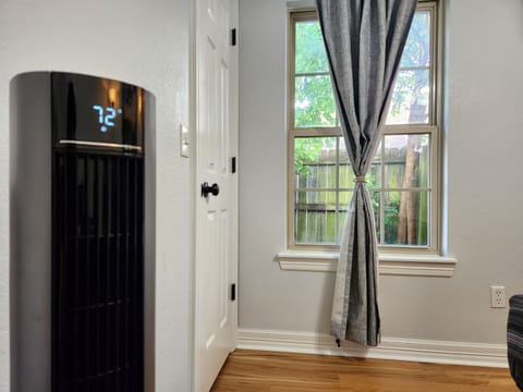 Queen bedroom w/ Lasko fan.