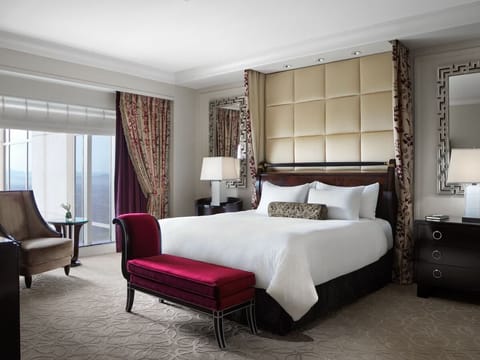 Settle into a serene king bed with soft, warm lighting.
