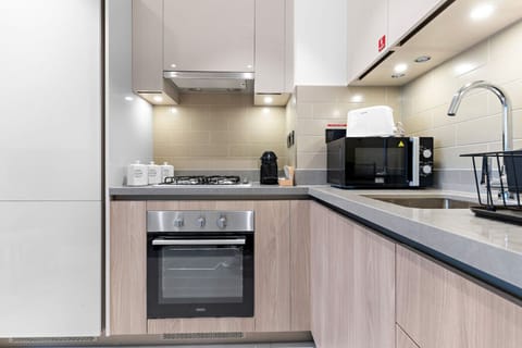 Kitchen: Sleek design with modern appliances, perfect for culinary adventures in Dubai!