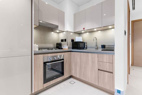 Kitchen: Cook up culinary delights in this stylish, modern space with high-end appliances!