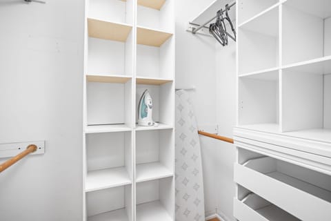 Discover convenience and organization in our closet, complete with an iron, ironing board, and hangers for your use.