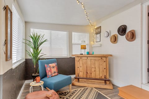 Game room with mini bar giving eclectic vibe