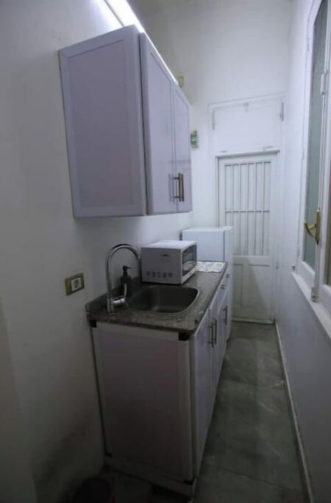 Fridge, microwave, electric kettle, cookware/dishes/utensils