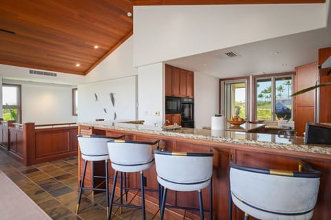 Bar seating at the kitchen counter for a moring coffee or visiting with chef!