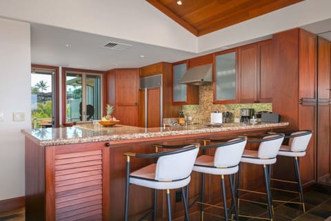 Smooth wood cabinetry and exquisite views - a chef’s delight!