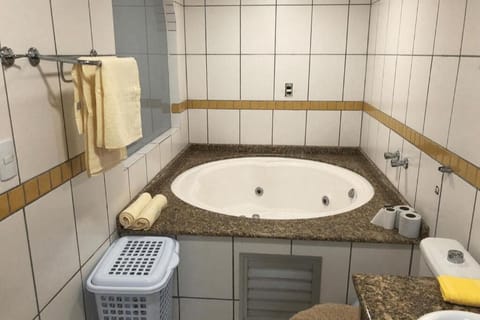 Jetted tub, hair dryer, towels, toilet paper