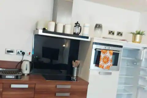 Kitchen with fridge, freezer, cookin hobs, dishwasher, kettle, cafeteria