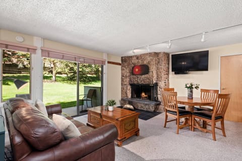 This spacious studio features a cozy living area, full kitchen, wood fireplace, private patio and gas grill.
