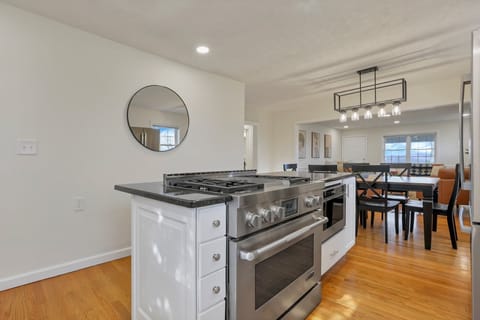 Full sized open kitchen w/ gas range and stainless steel appliances