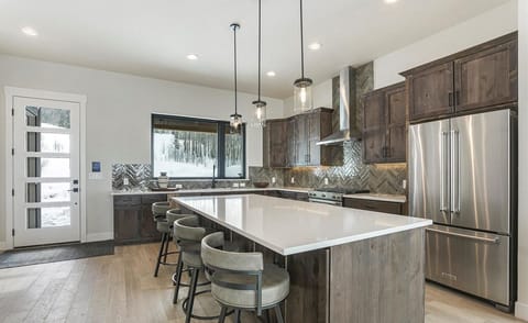 Seating for 4 at the kitchen bar.