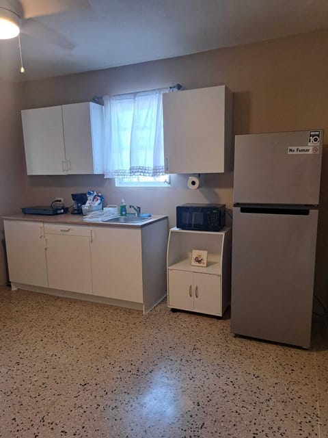 Fridge, microwave, stovetop, coffee/tea maker