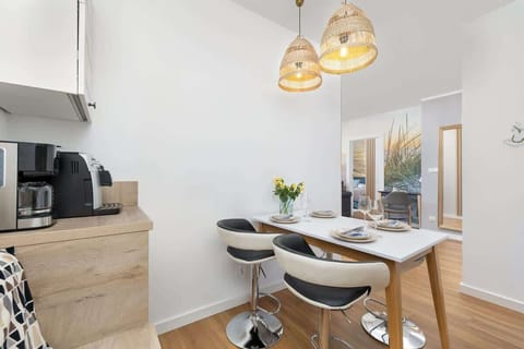 The sleek design of the kitchenette blending seamlessly with the living area.