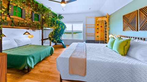 Into the Forest includes 7 fun, themed bedrooms including this cabin bunk bed with tube slide + amazing lake views!