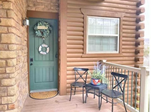 Condo entrance, there is ramp and a set of stairs.