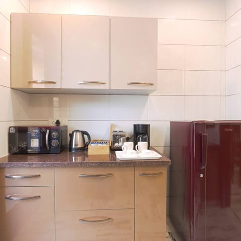 Fridge, microwave, stovetop, coffee/tea maker