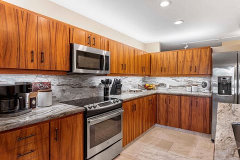Preparing meal is a breeze in the kitchen with stainless steel appliances and wide counter space.