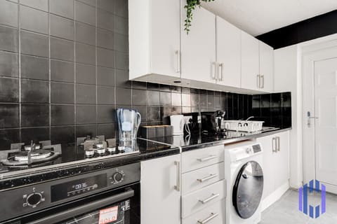 Kitchen. Fully equipped with cooking equipment perfect for families. Appliances such as fridge freezer, microwave, cooker, oven, dishwasher Toaster are free and available for your use.