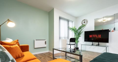 Living room  - 50'  Smart TV loaded with Netflix, ambient lighting,  extra fast Wi-Fi - Complimentary tea & coffee available for your enjoyment