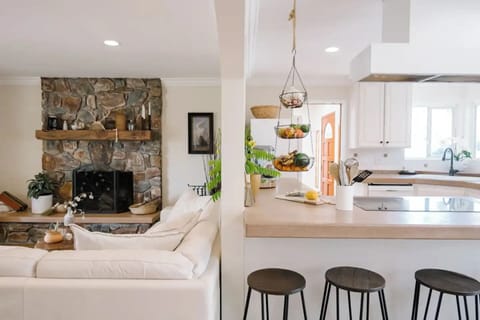 Spacious open-plan living area w/ a full kitchen & warm fireplace