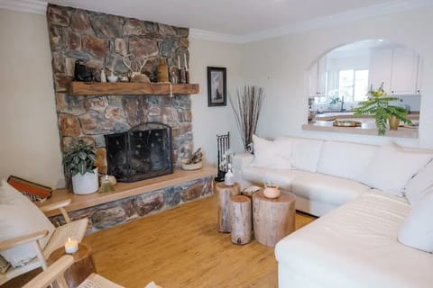 Cozy up on the Italian leather sofa next to the masonry wood burning fireplace