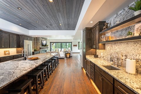 The kitchen connects the living and dining areas, creating a beautiful space for the whole group to gather.