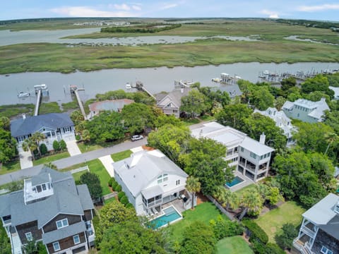 Experience the tranquility of nearby homes nestled amidst lush nature and serene water views.