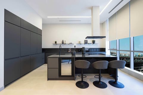 Fully equipped kitchen with panoramic views of West Beach and the Palm