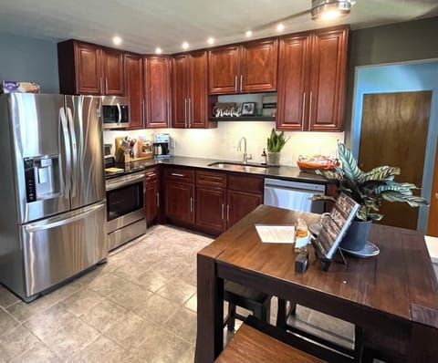 Beautiful kitchen is fully stocked.