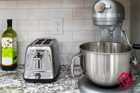 "Indulge your culinary dreams in Irvie Homes' gourmet kitchen, complete with modern appliances and chic finishes. Perfect for foodies seeking a comfortable, stylish stay. #VacationRental #GourmetKitchen #HomeAwayFromHome"