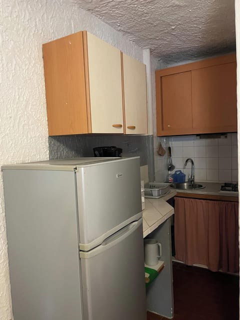 Fridge, microwave, coffee/tea maker, cookware/dishes/utensils