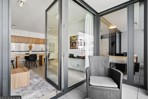 Spacious balcony offering a delightful extension of the living area, with comfortable seating and a view of the stylish interior.