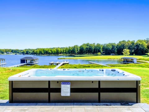 Relax in a lakeside hot tub with stunning water views, perfect for a tranquil getaway