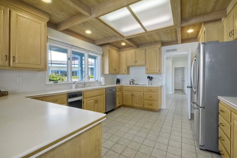 The kitchen features high-end stainless steel appliances and ample cabinetry.