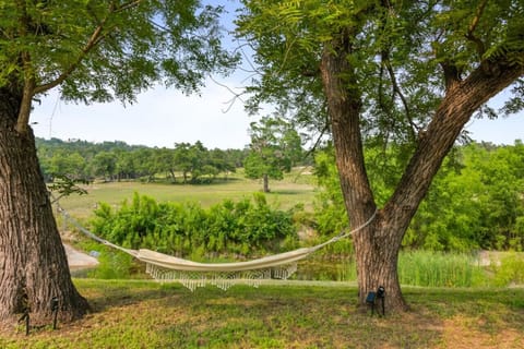 Relax by the creek in one of the many available hammocks